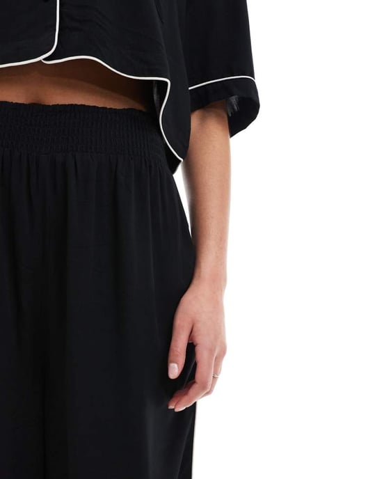 ASOS DESIGN Tall super soft slinky wide leg pyjama trouser in black with contrast binding - Image 4