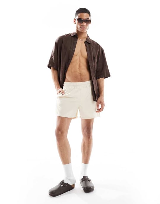 ASOS DESIGN swim shorts in short length in beige - Image 1