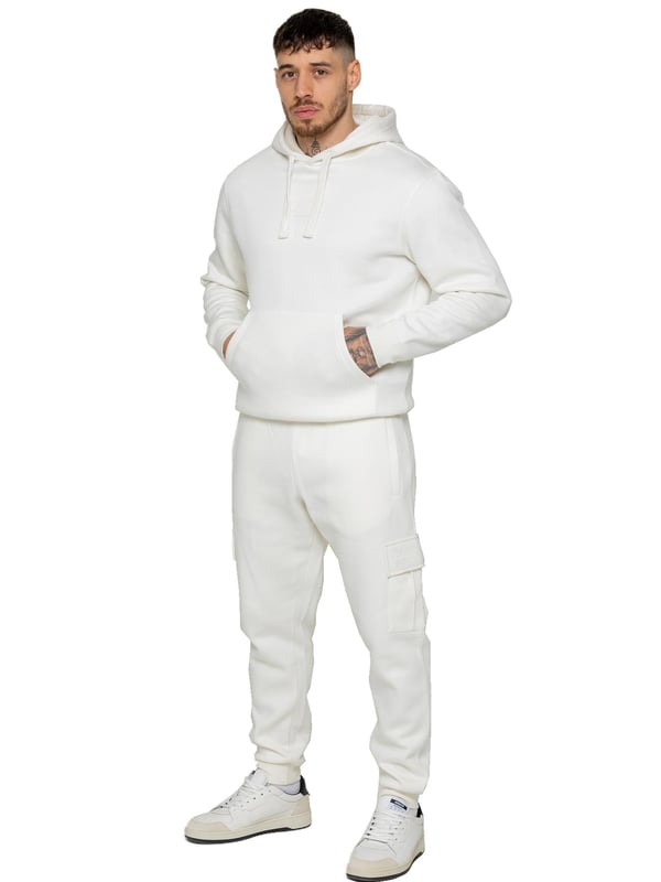 Experience superior comfort and style with Enzo Men's Regular Fit Cargo Joggers! Crafted with a brushed back inner fleece lining, these joggers are designed to keep you cozy all day long. Perfect for casual wear, they feature convenient 2 side slash pockets and 2 cargo pockets, providing ample storage space for your essentials. Stay on-trend with the cuffed leg design, offering a modern silhouette and added comfort.