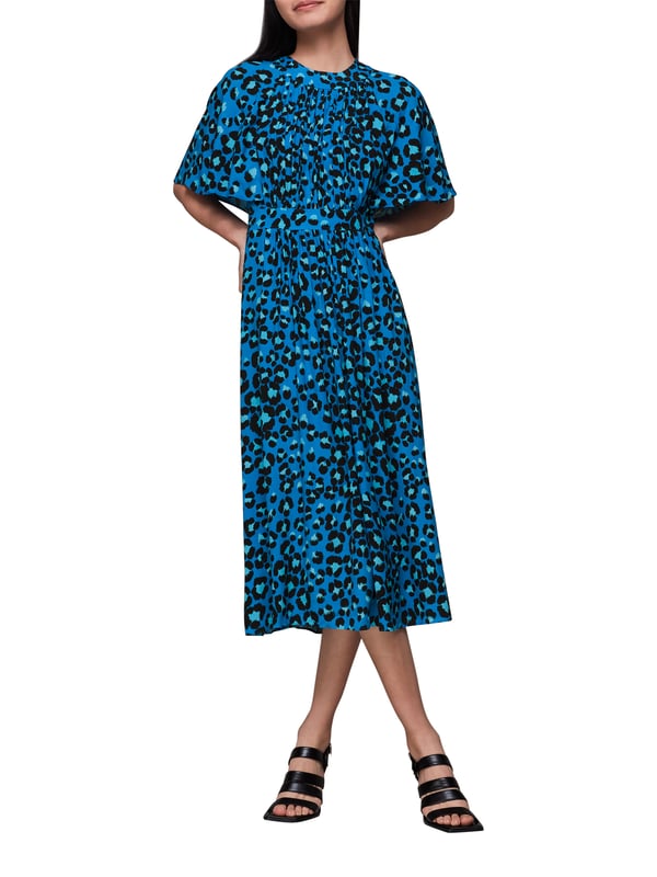 Step out in sustainable style with our 'Painted Leopard Midi Dress', perfect for adding a splash of colour and pattern to your day. Whether enjoying leisure time or dressing up for a casual outing, this eco-conscious piece with its tie neck and comfortable fit brings an effortless flair to any wardrobe.