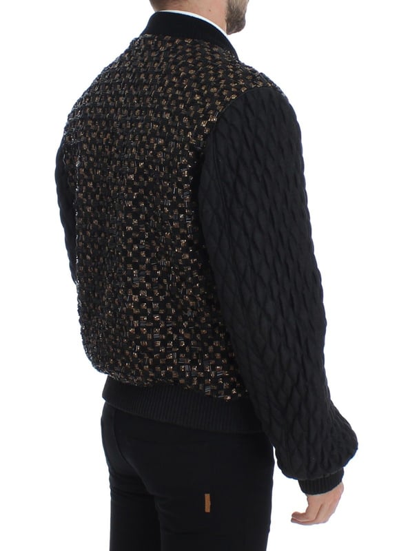 100% authentic Dolce & Gabbana black sequined jacket with gold detailing
  Straight from the Runway/catwalk
  Full zipper closure
  Four front pockets with zipper closure
  Two inside pockets
  Gold and black colored sequined detailing
  Quilted stitched arms
  Warm inner lining
  Logo details and logo engraved metal detailing
  Made in Italy
  Material: 35% Goatskin Leather 30% Lana wool 20% Glass 10% Plastic 5% Wool
  Lining: 42% Rayon 42% Acetate 16% Goatskin
Material: 35% Goatskin Leather 30% Lana wool 20% Glass 10% Plastic 5% Wool
