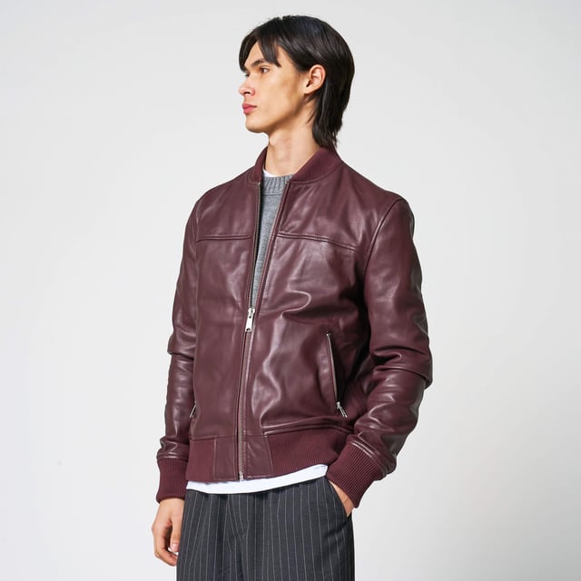 Men’s Barneys Originals real leather bomber jacket in burgundy. A bold pop of color for any occasion. Features a centre front zip, two zip pockets, and knit rib detailing on the cuffs and hem for a classic finish.