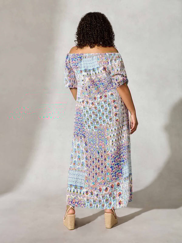 Details

Elastic bardot neckline
Short sleeves with gathered elastic cuffs
Side split in hem
Maxi length
Empire seam

Garment Care

Composition: 98% Viscose 2% Elastane
Machine washable  

Sizing

Model height: 5ft 10inches/178cm
Length from back neck to hem: 111cm

Printed all over with a pretty mosaic print, this maxi dress is cut from a soft woven fabric that moves beautifully. It has an elasticated neckline which can be worn on or off the shoulder, as well as short, elasticated sleeves which create an elegant silhouette when paired with its empire seam and side split at the hemline.