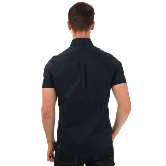 Mens Luke 1977 Iron Bridge Short Sleeve Shirt in navy.- Button down collar.- Short sleeves.- Chest pocket.- Button fastening.- Embroidered branding.- Shaped hem.- 98% Cotton  2% Elastane.  - Ref: M590802NAVY