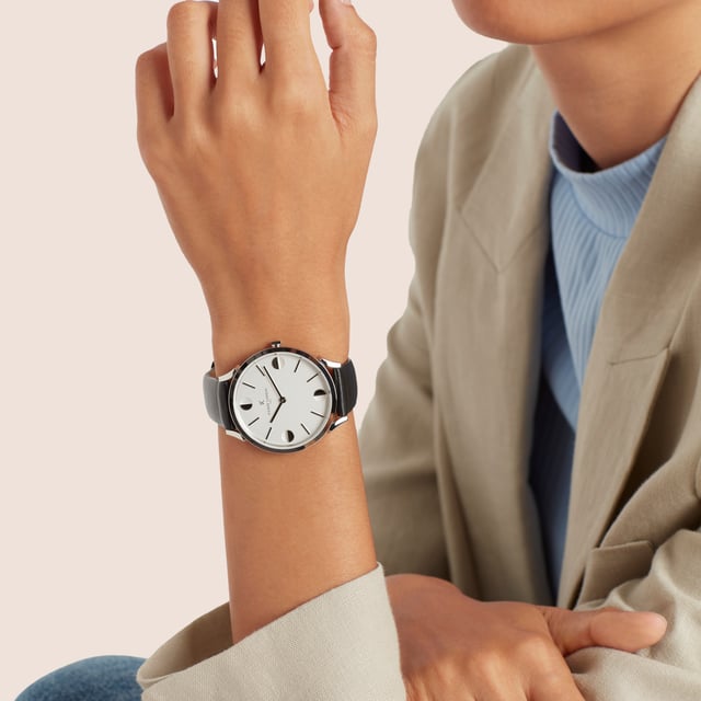 This Pierre Cardin Pigalle Half Moon Analogue Watch for Unisex is the perfect timepiece to wear or to gift. It's Silver 40 mm Round case combined with the comfortable Black Leather watch band will ensure you enjoy this stunning timepiece without any compromise. Operated by a high quality Quartz movement and water resistant to 3 bars, your watch will keep ticking. This casual and modern watch is perfect for all kind of casual activities, indoor activities or daily use, it's also a great gift for family and friend. High quality 21 cm length and  18 mm width Black Leather strap with a Buckle Case diameter: 40 mm,case thickness: 6.55 mm, case colour: Silver and dial colour: White