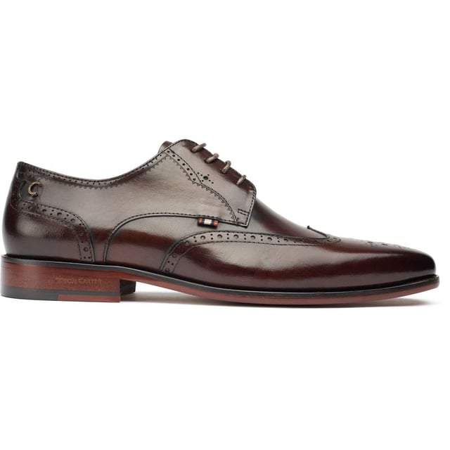 The Simon Carter Beagle Brogues Showcases A Perfect Blend Of Classy, Timeless Sophistication And Captivating, Daring Details. These Polished Shoes Redefine Sharp Styling With Their Unique Accents. Crafted From Premium Leather And Exclusive To Sole, The Simon Carter Shoes Ooze Personality And Uniqueness With Their Sleek And Elegantly Edgy Design. Whether Dressing For A Go-to-meeting, A Night Out Or Adding A Sharp Edge To Your Daily Attire, This Quintessential British Simon Carter Staple Ensures You Make A Distinctive Statement Of Style, Design And Personality.