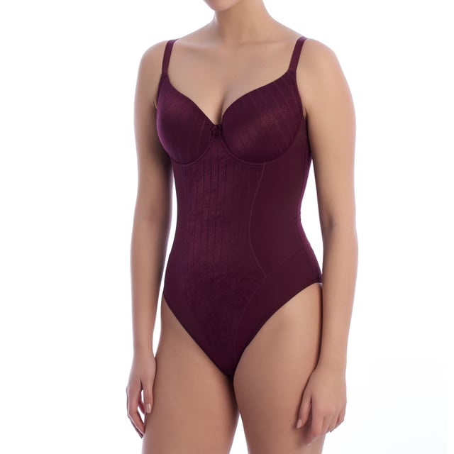 A sophisticated and functional design defines this women's shaping bodysuit, ideal for stylizing the figure with an elegant touch. Its underwire cups and floral details add a feminine touch while providing a secure and comfortable fit.


 Characteristics:

 - Made of high-quality shaping fabric that stylizes the silhouette and enhances the figure.
 - Underwired cups with light padding that provide support and enhancement to the bust.
 - Adjustable straps.
 - Soft and breathable materials, ensuring freshness and comfort all day long.
 - Front detail with floral texture in the abdominal area.
 - Smooth back design with full coverage for a smoothing effect and no marks under clothing.

 This women's underwire bodysuit is perfect for those looking for a shapewear garment that combines style and functionality, ideal for wearing under tight-fitting clothing or as part of a sophisticated look.
 Composition: 56% Polyamide, 31% Polyester, 13% Elastane
 Care:
Wash at maximum temperature 30º.
 Do not iron.
 Do not use bleach.
 Do not tumble dry.
 Do not dry clean.