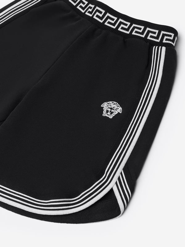 Versace envision bold, innovative abstracts in their beautifully crafted aesthetics. These boys shorts encapsulate the Italian label's passion for daring and unparalleled technology. Envisioned in soft cotton. They showcase the embroidered Medusa in white on the front with white stripes. The sophisticated pair are complete with an elasticated jacquard waistband and brand signature Greca motif.‚ Made in Italy‚ Machine Wash 30*C‚ 100% Cotton