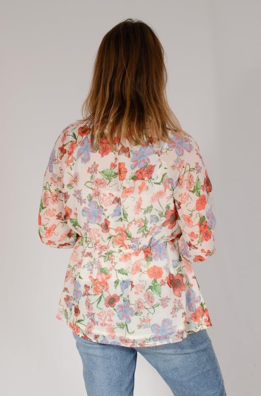 Lined but lightweight polyester, with a chiffon feel. Floaty and relaxed fit. Pair with pale jeans for a fresh and summery outfit, but great for any season paired with darker bottoms. Fit: Relaxed, Sizing: As expected