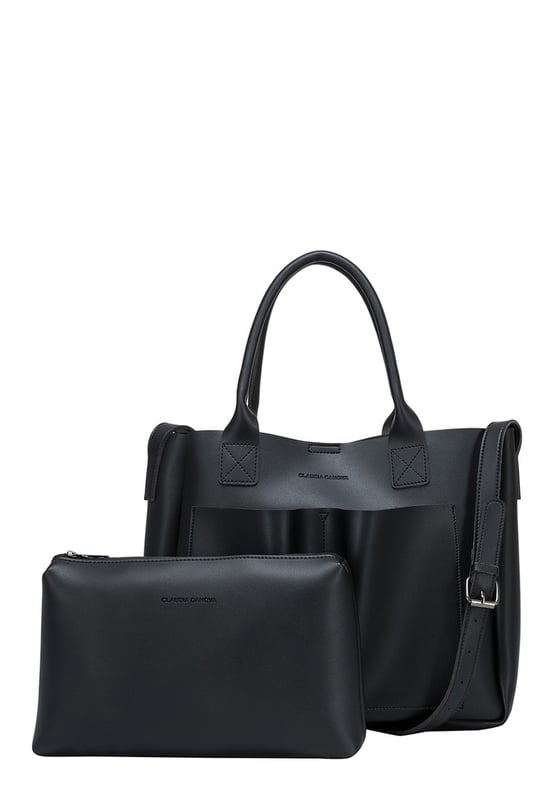 Be anything but basic with this classic wardrobe staple. The Megan XL Tote is the perfect accessory for making a statement and is highly functional too. Inside is a spacious compartment, big enough to carry the days essentials. You can also find a pouch which can be removed, ideal for storing items you want to keep extra secure, or use it as a mobile makeup bag! You have a choice of styling with the tote grab handles and the adjustable shoulder strap, so you can change your look depending on your chosen style! Features: , Lightly textured PU exterior, Claudia Canova debossed logo, Magnetic clasp fastening, Two exterior slip pockets, 2 x tote grab handles, Adjustable shoulder strap, Interior pouch which can be removed using the snap button clasps, Pouch measurement: W 304 x H 203 x D 63 mm, Zip top fastening on interior pouch Style Ref: 84607 BLACK