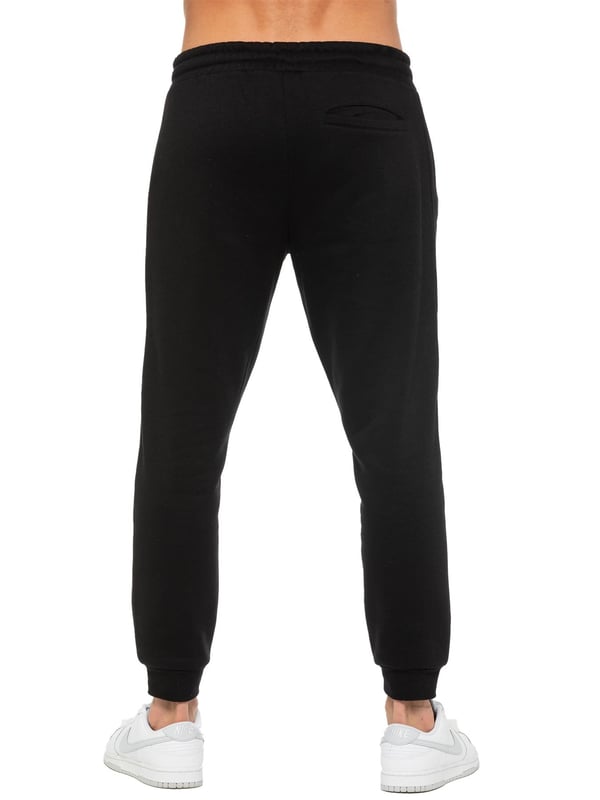 Enzo Mens Regular Fit Joggers. Elasticated Waistband With Adjustable Drawstring. Features 2 Side Slash Pockets & Single Welt Back Pocket. Cuffed Ankle. Features EZ Logo.
