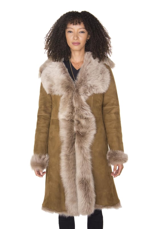 A testament to the luxury appeal of sheepskin, this slim fit jacket is proudly manufactured in our London factory by our veteran craftsmen. This coat comes in 8 of our finest colourways and is characterised by the generous exposure of sheepskin at the front for an extravagant and classy look. This jacket comes with a pocketless finish and the seams at the jacket edges are all left natural for a classic look. We’ve crafted this jacket from Spanish Toscana wool which is renowned for being among the most soft and silky sheepskins and the result is a jacket which is unquestionable in terms of quality and unparalleled in its provision of warmth and comfort. Upon request we can make this jacket in any length that you wish to ensure that you can enjoy this piece to its fullest potential, please feel free to contact us by email. • Crafted from high-quality double-faced sheepskin • Thick sheepskin lining is renowned for providing warmth and comfort • Features a luxurious revere collar that fastens with hooks and loops • Available in 8 different colours • Custom orders for different jacket lengths are available upon request