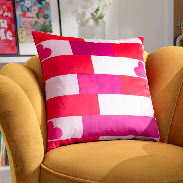 Dopamine Decor is an interior design and furniture collection designed to make you happy! Place this cushion on your sofa to make it stand out with its eye-catching design of interlocking stripe and heart patterns in bright, trendy tones, which fuse together to produce an explosion of vibrant colour. The perfect way to inject some personality into your living space.