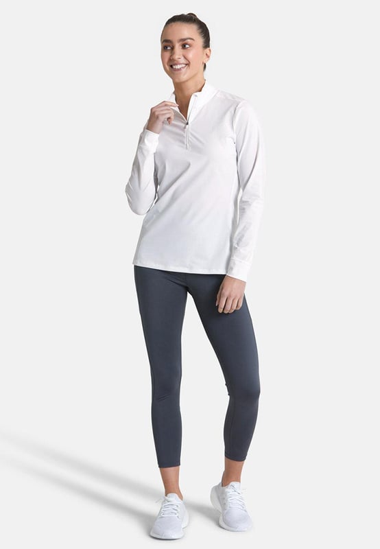 Stay comfortable and stylish with the Adaptive 1/2 Zip in Striker White. This versatile top's soft and lightweight fabric is perfect for any active endeavour, whether you're running errands or hitting the trails. The Striker White colour is bold and eye-catching, making you stand out from the crowd. An ideal choice for everyone.
