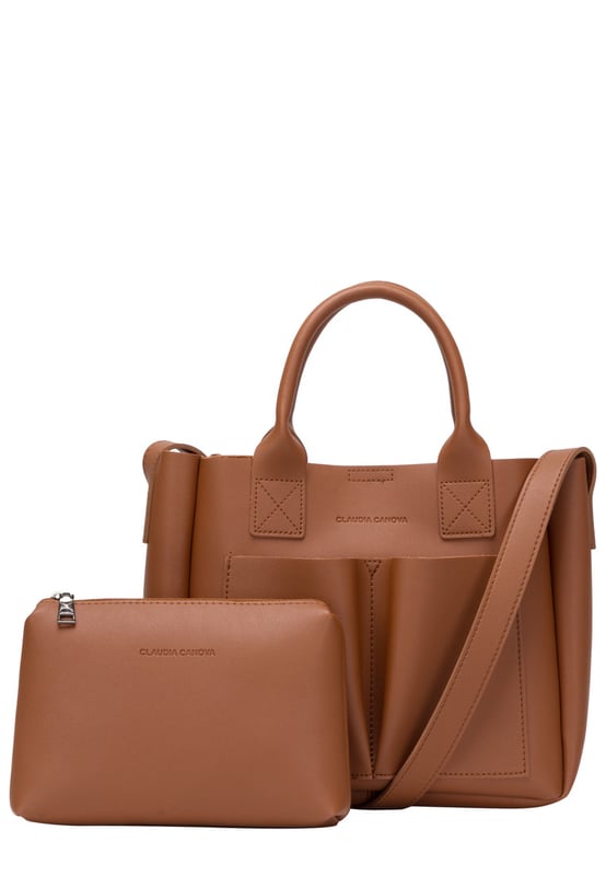 This dreamy mini grab bag is perfect for adding a contemporary look to your outfit. The soft PU exterior and contrast unlined interior gives it a premium finish and the gunmetal hardware adds quality. The subtle Claudia Canova blind debossed logo and intricate stitch detail finishes the look. Inside is a secure zip top pouch, which can be removed by unfastening the snap clasp buttons, perfect to use as a portable makeup bag or to keep valuable items more secure. Features: , soft pu outer, Unlined Interior, Claudia and Canova Blind Deboss Logo, 2 x Short Grab / Tote Handles, Adjustable longer shoulder strap, Magnetic snap claps opening to the main compartment, Removable zip top pouch (Meausure 215W x 152H x 50D), 2 x Quick access slip pockets in front Style Ref: 84608 TAN