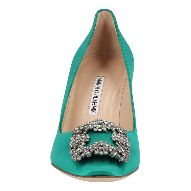 Satin almond toe pumps featuring a square crystal buckle encased in a gunmetal frame. Finished with a stiletto mid heel.

Upper: 68% viscose, 32% silk.
Sole: 100% cow leather.
Lining: 100% kid leather.
Heel measures 90 mm.
Made in Italy.