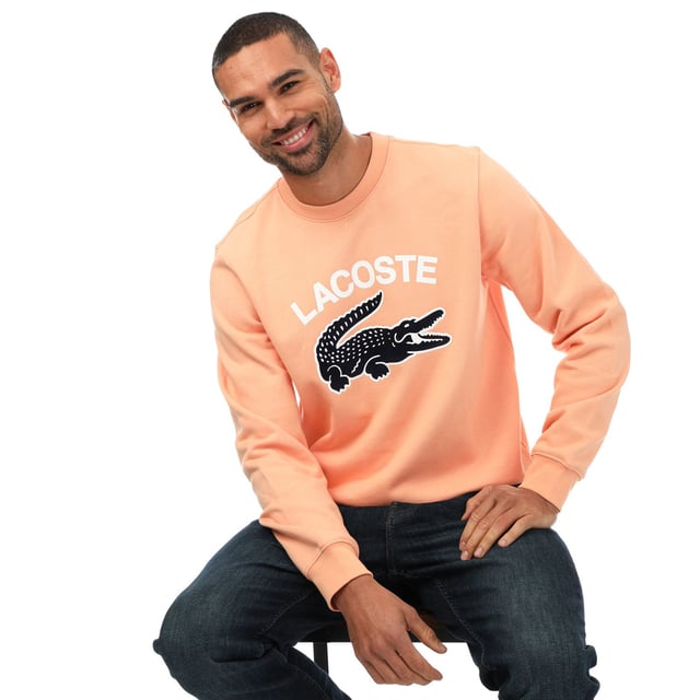 Men's Lacoste Crocodile Print Crew Neck Sweatshirt- Classic fit  natural ease:- Crew neck:- Lacoste lettering and oversised crocodile on front: - Embroidered crocodile on bottom: - Unbrushed cotton fleece: