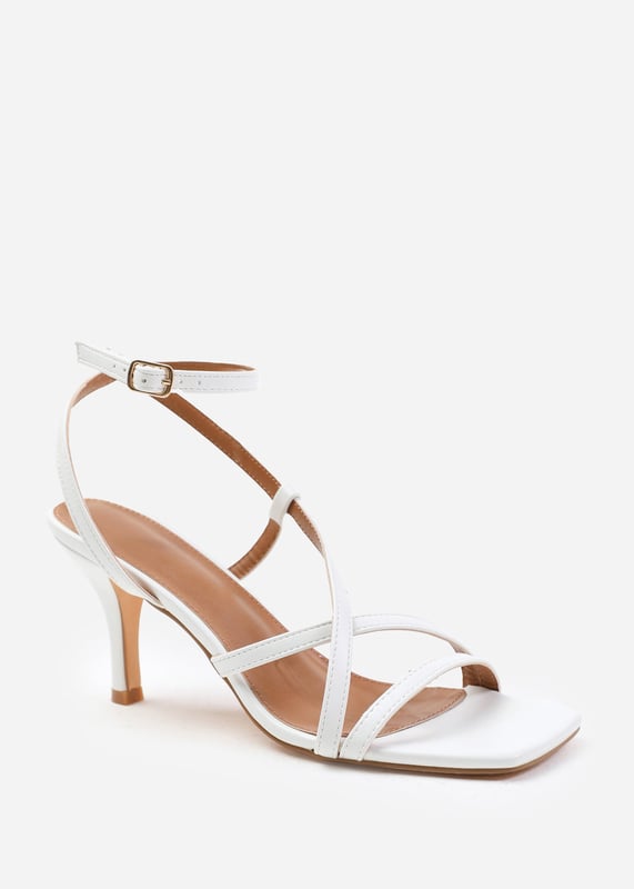 Step out in style and sophistication with our Austin Wide Fit Multi Strap Cross Over Mid Heels. These stunning heels are designed to elevate your outfit and add a touch of glamour to your every step.

Key Features:



Strappy Design: The multi-strap detail adds an elegant and polished touch to these shoes, making them the perfect option for those who want to make a fashion statement.

Comfortable Height: The mid-high heel provides stability and support, while the cushioned insole ensures all-day comfort. Walk confidently knowing that your feet will stay comfortable, no matter where the day takes you.

Open Toe: Open toe design adds a chic and fashionable element to these high heels, showcasing your pedicure and adding sophistication to any outfit.


Specifications:


Material: Faux Leather
Heel Height: 2’ (5.08cm) approx
Strap Detail: Multi-strap design adds elegance and polish to these shoes
Closure: Buckle closure for a secure and adjustable fit

Elevate your style and make a statement with our Austin Wide Fit Multi Strap Cross Over Mid Heels. These shoes combine fashion and functionality, allowing you to showcase your individuality while enjoying all-day comfort. Step out with confidence and embrace your inner trendsetter.