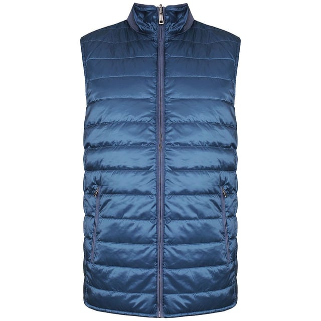 Hackett London Reversible Men's Navy Blue Gilet – a versatile and practical outerwear piece designed to offer both style and adaptability. This gilet (also known as a vest or bodywarmer) is thoughtfully crafted to provide insulation and the unique feature of reversibility, giving you multiple looks in one garment. Here are the key features of this exceptional navy blue gilet:

 Reversible Design:  One of the standout features of this gilet is its reversible design. It allows you to enjoy two distinct looks in a single garment. You can choose to wear it with either side facing out, offering versatility and style options.

 Premium Quality Material:  Crafted from high-quality materials, this gilet ensures both comfort and durability. Hackett London is known for its commitment to quality craftsmanship.

 Navy Blue Color:  The gilet features a classic navy blue color that signifies sophistication and versatility. Navy blue is a timeless choice that complements various clothing options.

 Sleeveless Design:  With a sleeveless design, this gilet provides freedom of movement for your arms while keeping your core warm. It's suitable for layering over sweaters, long-sleeve shirts, or under other outerwear.

 Zipper Closure:  The front of the gilet is equipped with a full-length zipper closure, ensuring easy on and off. The zipper is often designed for durability and practicality.

 Stand-Up Collar:  The stand-up collar adds a touch of style and provides additional warmth and protection against chilly winds.

 Functional Pockets:  The gilet typically includes practical pockets, such as zippered hand pockets or inner pockets, offering convenient storage space for small essentials or keeping your hands warm.