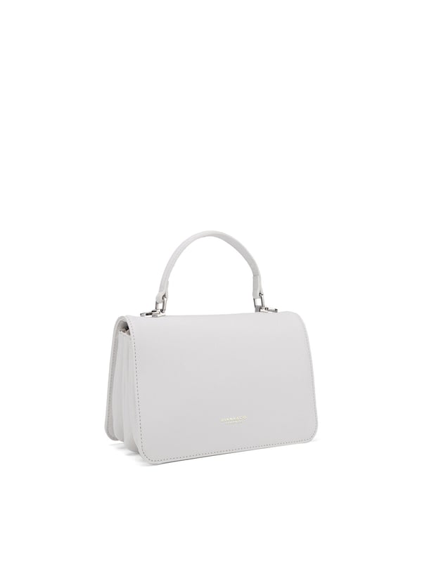 Damenhandtasche mit Magnetknopfverschluss. eine mit Reißverschluss-Innentaschen. fehlende Außentaschen. verstellbarer und abnehmbarer Schultergurt. Im PU-Griff. Drei Innenfächer.  Außenmaterial. Innen ungefüttert. Maße: 21x14x5,5 cm. Modeprodukt