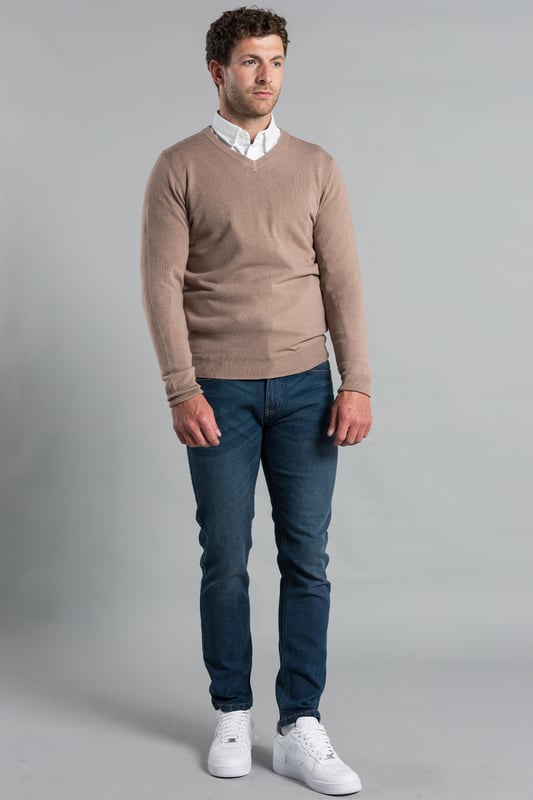 This V Neck jumper from Kensington Eastside is a season essential. Features long sleeves and ribbed elasticated neck, waistband and cuffs. Crafted from high-quality materials, this jumper is machine washable for easy care, making it both stylish and practical. Ideal for layering or wearing on its own, it's a versatile piece that complements any outfit.