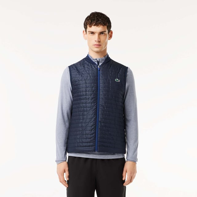 Designed for Tennis & Golf  for a regular frequency of use. This reversible padded sleeveless jacket is made with bonded quilting mixed with stretch taffetas on one side for an athletic silhouette and full bonded quilting for a more elegant look. This 3rd layer will keep you warm during your outdoor training. This product is providing you water repellent fabric which guarantees you to remain dry in bad weather conditions. Regular fit: natural ease on body It has been tested by professionals players to ensure functionality. The most adapted fashion sport apparel and accessories items to our Golf and Tennis athletes to prepare for and for game day.
