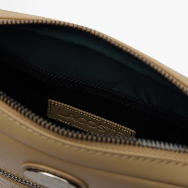 Leather Monogram Print Vertical Satchel.- Dimensions: L5.9 x H8.3 x D2 in.- L15 x H21 x D5 cm.- Exterior in split calfskin leather.- Adjustable strap: 75cm - 140cm - 29.5 - 55 in.- 1 zipped pocket on outside, 1 mesh patch pocket on inside.- Enamel plaque with crocodile logo. Material: 100% Polyurethane. Ref: NH4486MRC87.