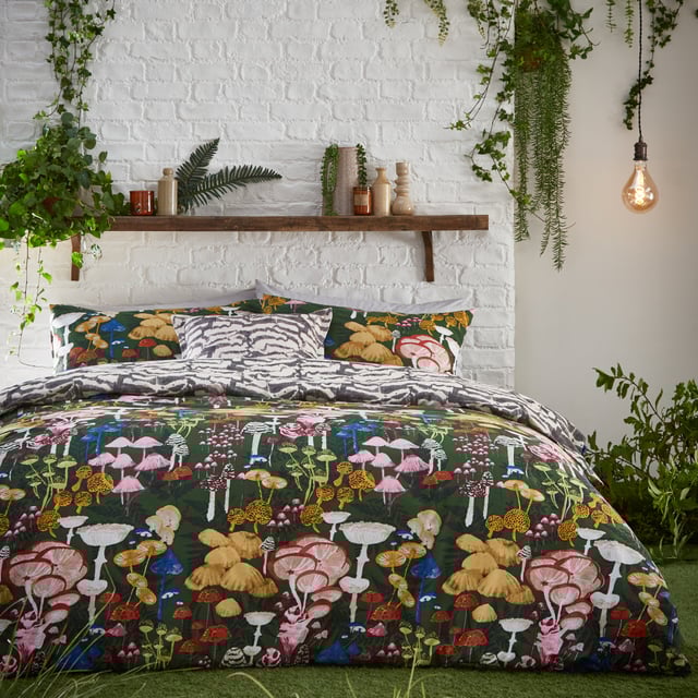Mushrooms are enjoying their moment in home and fashion designs right now! This is reflected by the amazingly detailed hand-painted Amanita duvet cover set which celebrates the intricate world of fascinating fungi and mystical mushrooms. They glow brightly against the dramatic coloured background, which gives this design a unique twist, alongside surrounding organic shapes. The abstract printed reverse is inspired by the textural underside of a mushroom and is in natural tones for a more neutral look if desired. A fabulous on-trend design which will add both intrigue and a hint of mystery to your bedroom.