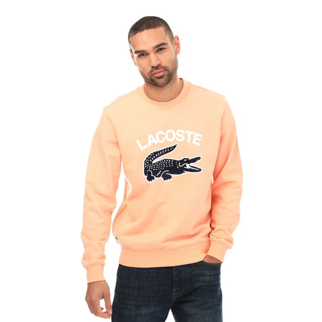 Men's Lacoste Crocodile Print Crew Neck Sweatshirt- Classic fit  natural ease:- Crew neck:- Lacoste lettering and oversised crocodile on front: - Embroidered crocodile on bottom: - Unbrushed cotton fleece: