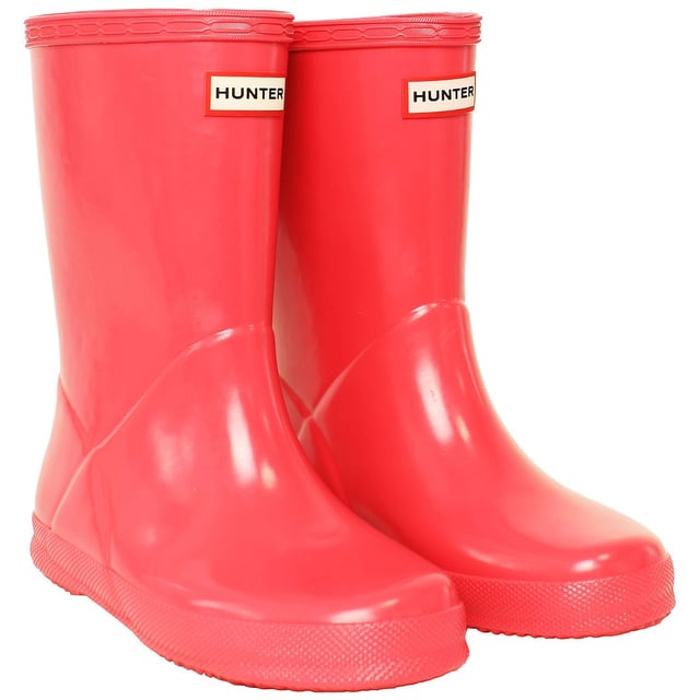 Let your child make a splash in style with the Hunter Gloss Kids Pink Wellington Boots. These boots are a miniature version of the iconic adult style, offering the perfect blend of functionality and fashion. The glossy finish adds a touch of sophistication to the classic design, making them a must-have for every young trendsetter.

Key Features:

 Glossy Finish:  The standout feature of these boots is the glossy exterior, adding a chic and stylish element to the classic Wellington design. The shiny pink hue makes these boots a fun and fashionable choice for rainy days.

 Durable and Waterproof:   Crafted from high-quality rubber, these boots are built to withstand the elements. The waterproof construction ensures that your child's feet stay dry and comfortable, making them suitable for various outdoor activities.

 Comfortable Interior:   Designed for all-day wear, the boots feature a comfortable interior with a cushioned insole. Your child can enjoy extended playtime without sacrificing comfort, making these boots ideal for both casual outings and outdoor adventures.

 Easy to Wear:   The pull-on style and adjustable strap make these boots easy for kids to put on and take off independently. The wide opening and pull tabs enhance convenience, allowing for hassle-free dressing.

 Sturdy Grip:   The slip-resistant sole provides excellent traction on different surfaces, ensuring stability in wet and slippery conditions. These boots are designed to keep your child sure-footed while exploring the outdoors.

 Reflective Logo:   For added safety, the boots feature a reflective Hunter logo. This detail enhances visibility in low-light conditions, making them a practical choice for early morning or evening activities.

 Iconic Branding:   Showcasing the iconic Hunter logo on the front, these boots maintain the brand's reputation for quality and style. The pink color adds a playful touch, making them a versatile and eye-catching accessory.

Elevate your child's rainy-day wardrobe with the Hunter Gloss Kids Pink Wellington Boots â€“ a perfect combination of style, durability, and functionality that brings a pop of color to outdoor play.