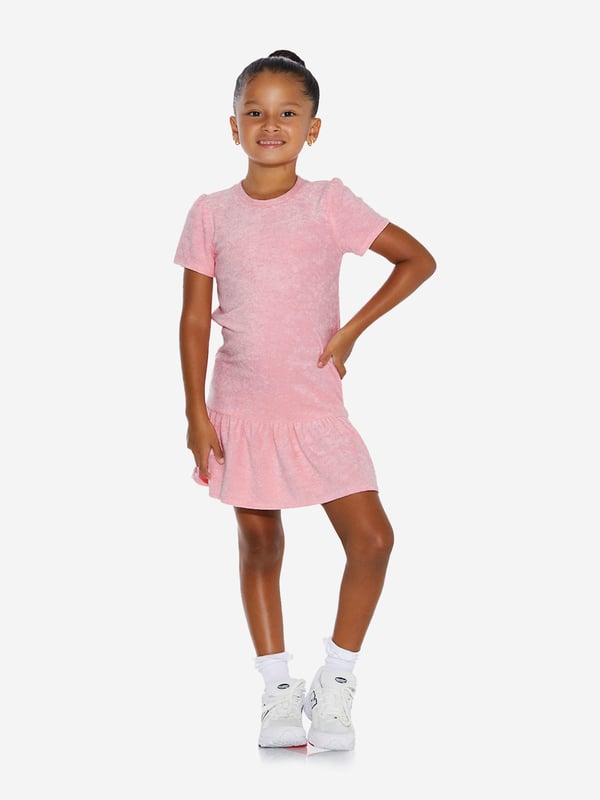 Comfort and style converge for this girls pink knit dress from AY by Ayla. Designed for young influencers, this cosy fleece piece is made for dreaming big with a fashionable twist. Perfect for playdates as well luxe lounging, the soft, lush fabric ensures that feel good factor. Roundneck Collar Dropped Waist Pleated Skirt
