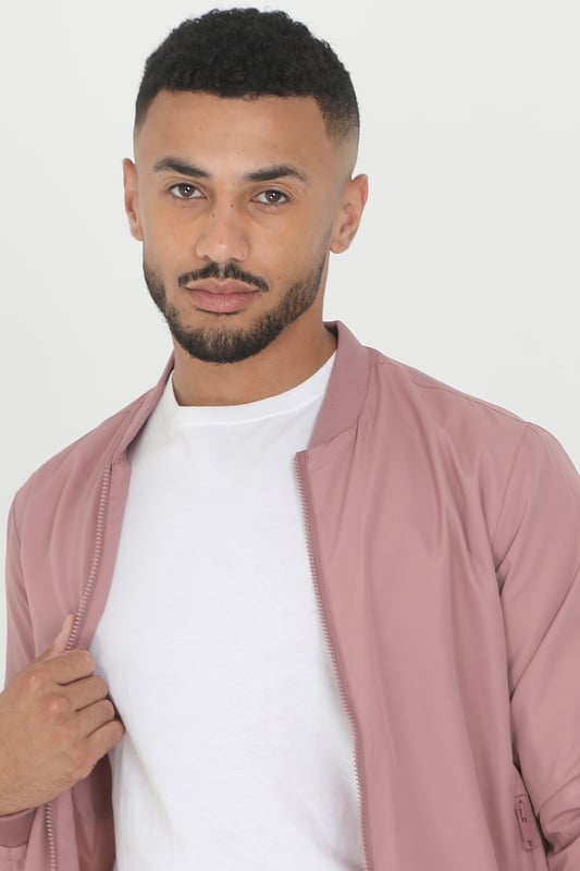 This bomber jacket from Brave Soul is a stylish and comfortable addition to your wardrobe. The ribbed hem, collar, and cuffs provide a classic touch, while the two lower zip pockets add a practical element to the jacket. With a regular fit, this jacket offers a relaxed yet trendy look and is fully lined. Whether you're heading out for a night out or running errands, this bomber jacket is sure to keep you comfortable and stylish.