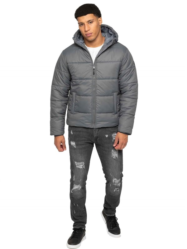 Introducing the Men's Hooded Puffer Jacket—a perfect blend of warmth and style. Featuring a high-neck design and long sleeves. The front zip-up closure offers a sleek and modern look, while the two spacious zipped side pockets provide practicality for carrying essentials. Ribbed cuffs and drawcord hem with adjustable toggle to add to the secure fit, enhancing overall comfort. Crafted from durable materials, this puffer jacket is both functional and stylish, ideal for everyday wear
•	Hooded Puffer Jacket
•	High-neck design
•	Ribbed cuffs
•	Drawcord hem with adjustable toggle