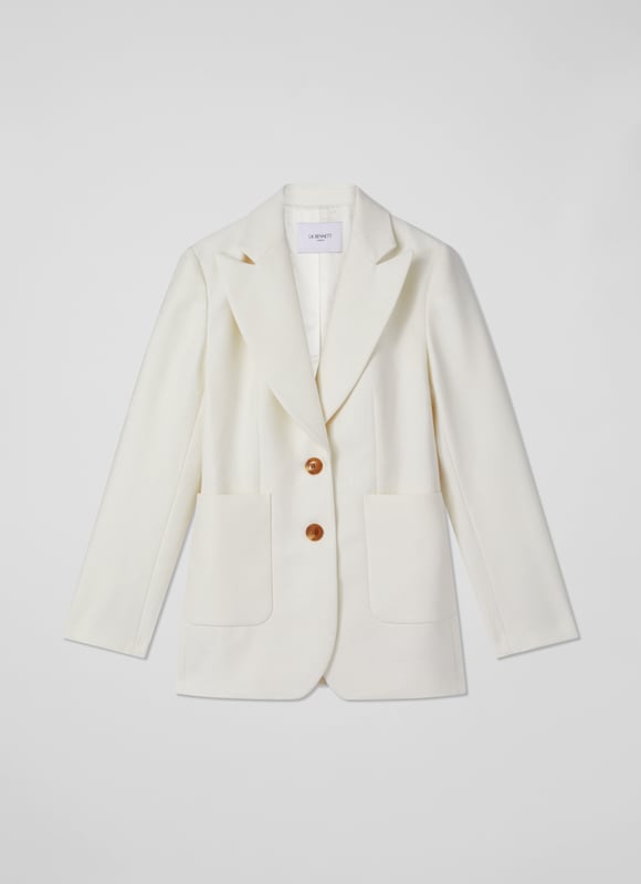 The perfect summer suit, the Avery jacket teams up with the matching waistcoat and trousers, but can also be worn to loosen up dresses or over jeans and a tee. Crafted in Portugal from beautiful Italian cotton in soft and textured cream, it has a straight cut, a wide, curved lapel, horn-effect buttons and large patch pockets to the front. Wear it with a pussy bow blouse and the Ami trousers or shrug it over a floral dress.