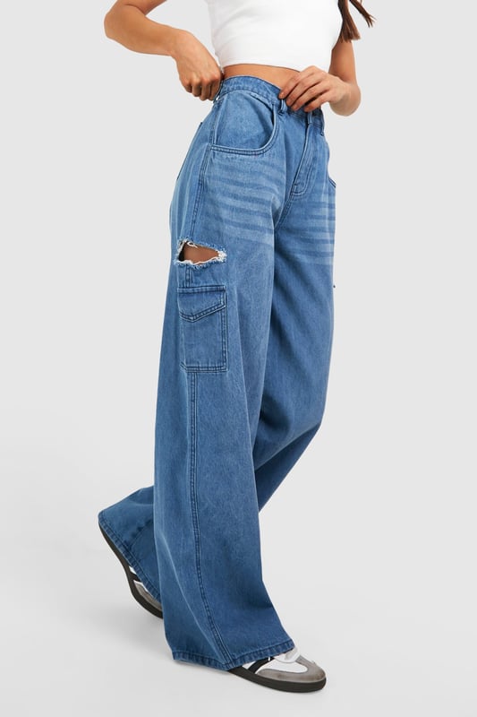 Tall Blue Washed Side Rip Wide Leg Jeans New season update has dropped: and it's tall jeans. Tailored to tall girls, a staple pair of jeans is essential, whether for a casual shopping outing or to dress up with a nice top and heels for a night out. Designed to fit 5'7 and over, these long leg jeans are made for casual everyday wear and are the lowkey clothing piece to make your outfit look fire. These jeans are longer line with more fabric in the leg and torso, fitting perfectly to your figure.Style: Wide Leg JeansDesign: WashedFabric: CottonLength: RegularModel's height: 178cm / 5'10"