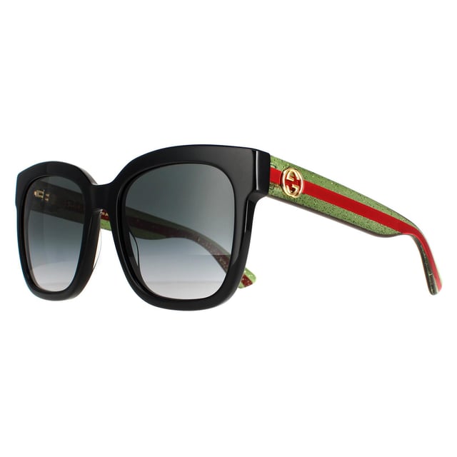 Las gafas de sol Gucci Square para mujer en negro con degradado gris de purpurina verde y roja GG0034SN son una montura glamurosa y sobredimensionada de forma cuadrada. La montura de acetato grueso es ligera y cómoda, con el emblemático logotipo metálico GG de Gucci en cada una de las patillas. Un estilo impresionante que siempre va a la última.
