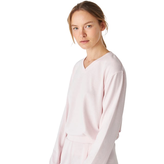Women's long-sleeved pajamas with an elegant and comfortable design, ideal for lounging or relaxing at home.

 Its modern and sophisticated design adapts perfectly to the female figure, enhancing the silhouette with a chic and relaxed style.

 The set includes a long-sleeved top with a delicate V-neck.

 The long trousers have a loose fit, two practical side pockets and an elastic waistband adjustable with drawstrings, ensuring a comfortable fit.

 Tonal exposed stitching adds a subtle yet elegant detail.

 Enjoy a design that combines fashion and functionality. Ideal for giving as a gift or for pampering yourself.
 Composition: Shirt: 72% Polyester, 23% Viscose, 5% Elastane; Pants: 72% Polyester, 23% Viscose, 5% Elastane
 Care:
-Wash on a gentle cycle.
 -Always use cold or warm water.
 -Do not use a dryer. It is better to air dry.
 -If necessary, iron at low temperatures.
 -Do not use bleach.