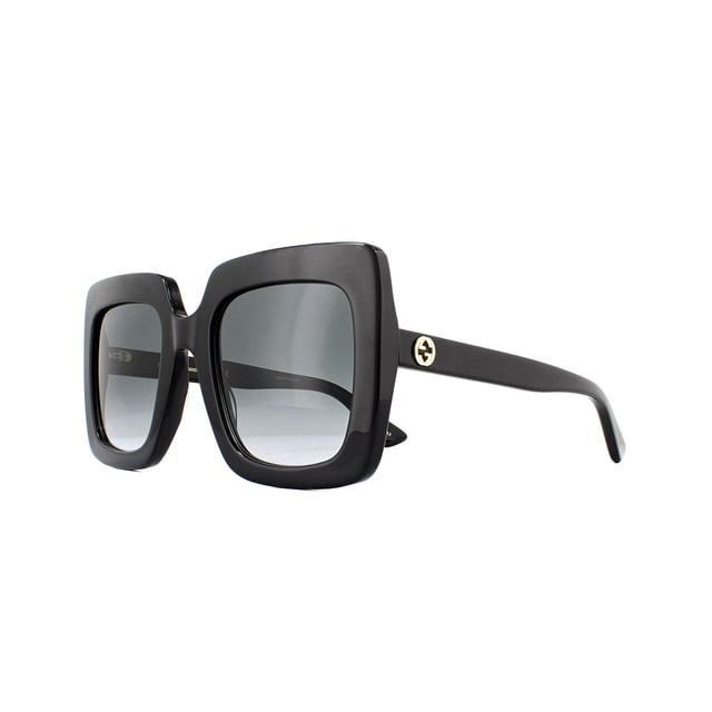 Gucci Zonnebril GG0328S 001 Zwart Grijs Gradiënt zijn een oversized vierkante ontwerp gemaakt van lichtgewicht acetaat. Slanke tempels bevatten het iconische in elkaar grijpende GG-logo in metaal.