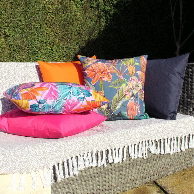 Bring the tropical feels to your outdoor space. Featuring a trio of exotic birds, this fully reversible design in vibrant orange tones is sure to stand out in any garden.