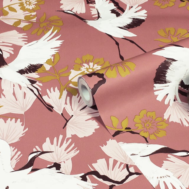 Glide through the air with the majestic birds soaring through tropical foliage with the Demoiselle wallpaper. These Exotic birds fly over an array of quirky leaves in a stunning range of hues and intricate detailing, will make a statement in whichever room you put it in. This wallpaper is a paste the wall application; simply paste the wall, hang your paper, and leave to dry. Each roll is 10m long and 52cm wide. Pattern repeat: 53cm Straight match. Our Demoise wallpaper can be used to paper the whole room or to create an eye-catching feature wall. This wallpaper is also wipeable so that any light marks can be dabbed away.