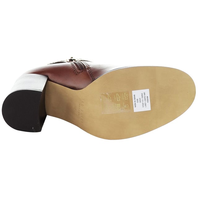 Indulge in the intersection of chic style and contemporary flair with the Ted Baker Anisea T-Hinge Women's Ankle Boots. Elevating your footwear collection with a perfect blend of sophistication and modern design, these ankle boots are sure to make a bold fashion statement.

Key Features:

 T-Hinge Embellishment:  The Ted Baker Anisea Boots feature the distinctive T-Hinge embellishment, a signature element that adds a touch of glamour and uniqueness to the ankle boots. This stylish detail not only catches the eye but also reflects Ted Baker's commitment to intricate design.

 Ankle Boot Silhouette:  Embrace a sleek and versatile silhouette with these ankle boots. The shorter height allows for easy pairing with a variety of outfits, making them a versatile choice for both casual and more formal occasions.

 Comfortable Fit:  Experience comfort without compromising style. The Anisea Boots are designed to provide a snug and comfortable fit, allowing you to walk with confidence throughout the day.

 Side Zipper Closure:  Effortlessly slip into these ankle boots with the convenient side zipper closure. This practical feature not only ensures easy on-and-off wear but also maintains the clean lines of the design.

Step into a world of fashion-forward elegance with the Ted Baker Anisea T-Hinge Women's Ankle Boots â€“ a perfect choice for those who appreciate distinctive design, luxurious materials, and versatile styling options. These boots effortlessly embody the essence of Ted Baker's commitment to timeless yet contemporary footwear.