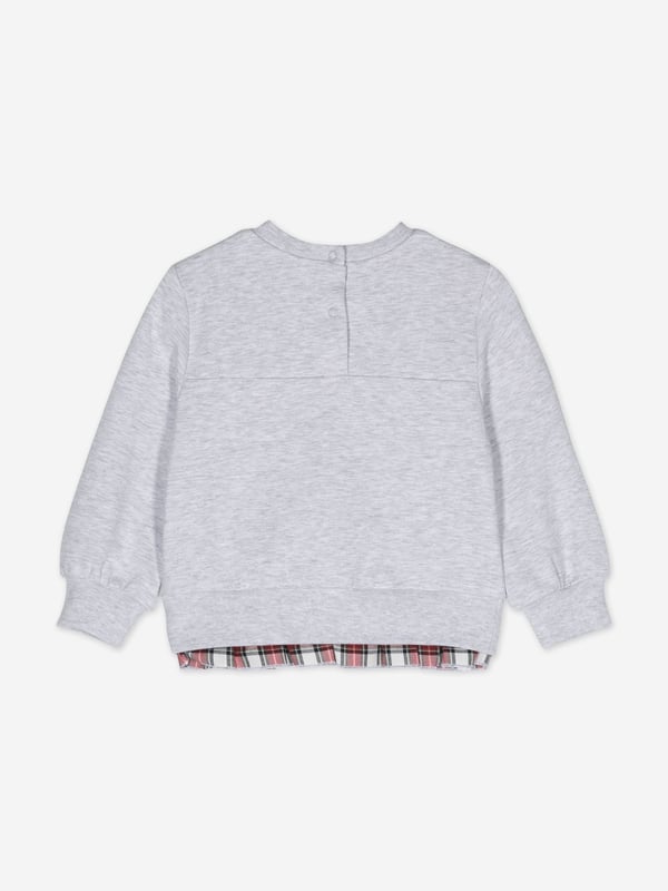 Monnalisa incorporate passion and innovation into their beautifully crafted designs. This baby girls teddy bear sweatshirt in grey is perfect for every fashionista. Depicted with a whimsical teddy bear graphic holding a red sequin adorned heart. It showcases an elasticated waistband, cuffs and contrast tartan trim. The sophisticated piece is complete with elegant 'Monnalisa' printing in scarlet. Pair with matching joggers. ‚ Round Neck‚ Long Sleeved‚ Press-Stud Fastening‚ 95% Cotton, 5% Elastane