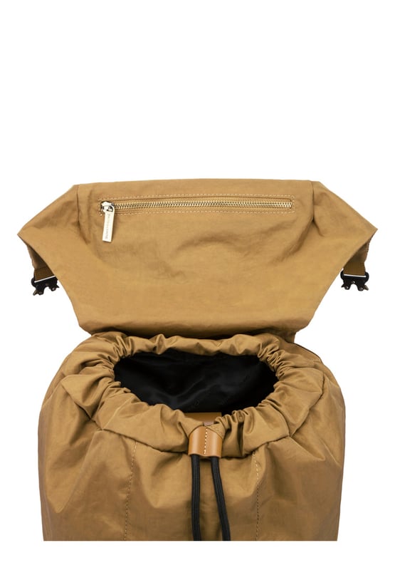 Cut from our signature nylon, the Flapover Nylon Backpack’s adjustable flap over opening provides easy access to your essentials with a secure double clip fastening. Inside there is ample space for a 15” laptop, twinned with external front and rear pockets for additional storage options. Features: , Flap over opening, Internal drawstring opening Front flap over zip pocket, Rear zip pocket, Internal flap over zip pocket SMITH & CANOVA antique brass logo, Branded antique brass zips, Padded grab handle, Adjustable padded backpack straps, Internal 15 inch padded laptop sleeve, Internal zip pocket, 2 Internal mobile phone slip pockets - fits normal and plus size smart phones, 2 Internal pen slip pockets Style Ref: 92680 TAN