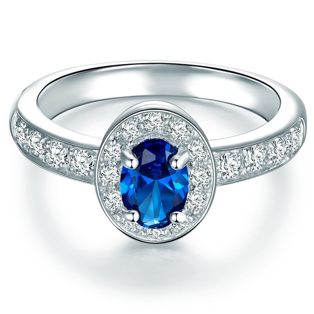 Anyone looking for an extraordinary engagement ring will love this exclusive entourage ring of the 1934 manufactory. The focus is on the blue zirconia, which is modeled on a sapphire, a ring -shaped comprises of smaller zirconia stones. The half -made ring rail also sparkles in a wreath of zirconia. The brilliant cut of the popular jewelry stones ensures a fascinating glitter that can hardly be distinguished from real diamonds with the naked eye. Guarantees an eye -catcher and a ring that brings a decent portion of glamor into the jewelry box even after the wedding!