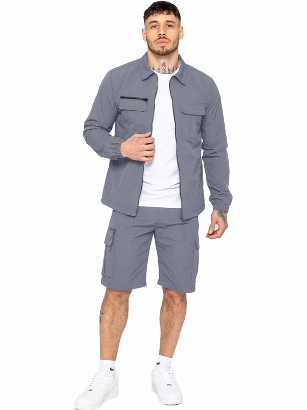 Engineered for comfort and versatility, these poly cargo shorts will elevate your casual wardrobe. Made from a durable woven crinkle fabric, they boast a relaxed elasticated waist and drawstring fastening for a perfect fit. Stay organized with zip-fastened side and leg pockets, adding a touch of utility to your summer ensemble. Pair with a classic t-shirt and trainers for effortless style.