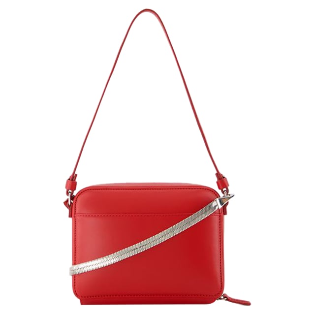 LEATHER- 80% polyurethane 20% polyester. Closure: Zipper closure. Interior fittings: back pocket.