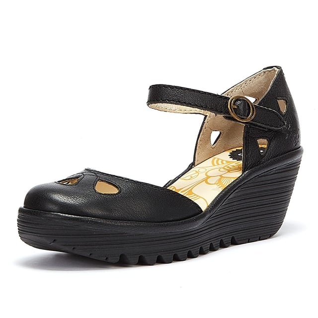The Yuna from Fly London is a platform sandal with elevated heel. Features include premium materials, drop-shaped cut outs, and a round buckle fastening. Complete with signature Fly London branding.