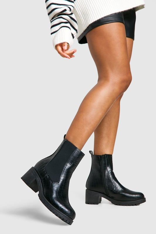 Crocodile-embossed texture for a luxe finish
        Chelsea-style with elastic side panels for easy on-off
        Chunky block heel measuring between 2.5 and 4.5cm
        Pull tab at the back for convenient wear
        Durable treaded sole for enhanced grip
    
    Step out in style with these versatile Chelsea boots, perfect for the fashion-forward woman who values both comfort and trend-setting looks. The crocodile-embossed texture adds a touch of sophistication to any outfit, while the elastic side panels ensure a snug fit and easy wear. Pair these boots with skinny jeans and an oversized jumper for a casual day out, or dress them up with a flowy midi skirt and leather jacket for an evening with friends. The low block heel offers just the right amount of lift without compromising on comfort, making these boots ideal for all-day wear. Whether you're heading to a family gathering or a casual catch-up with mates, these Chelsea boots will keep you looking effortlessly chic and feeling confident. Their robust construction and timeless design make them a wardrobe staple that you'll reach for season after season.