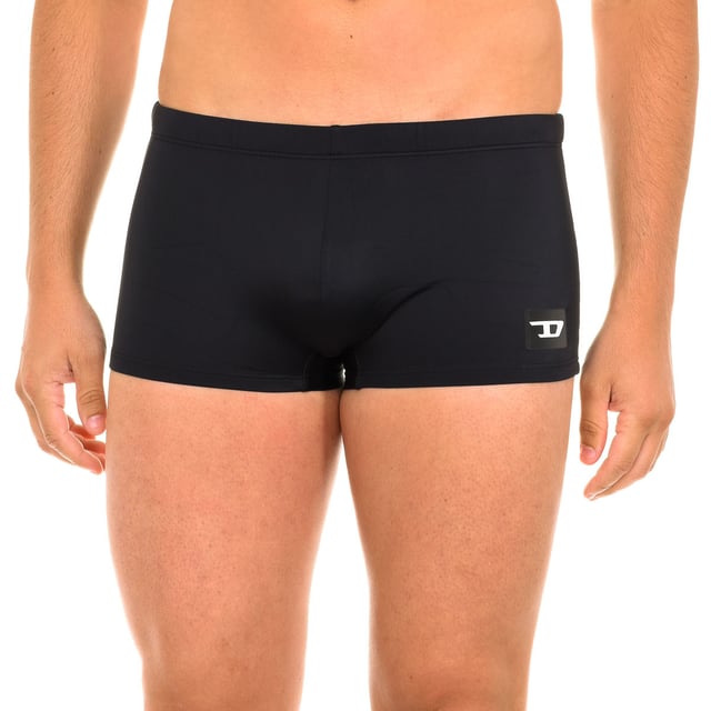 Boxer swimsuit. 
 Color Black 
 Elasticated waistband, adjustable with laces. 
 Brand print on the lower side. 
 Inner lining. 
 Seams in tone. 

 Composition: 
 - 78% Nylon - 22% Elastane. 

 Washing instructions: 
 - Wash at max. 30º. 
 - Do not use bleach. 
 - Allows dry cleaning. 
 - Do not iron. 
 - Do not use dryer. 

 Composition: 78% Nylon, 22% Elastane
 Care:
- Wash at max temperature. 30º.
 - Do not use bleach.
 - Allows dry cleaning.
 - Do not iron.
 - Do not use dryer.