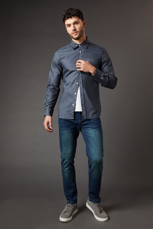 Slim fit design for a modern, tailored silhouette
        Dark vintage wash adds a classic, lived-in look
        Stretch fabric for enhanced comfort and mobility
        Five-pocket styling for practicality and authenticity
        Versatile dark hue perfect for various casual ensembles
    
    These Burton Dark Vintage Wash Stretch Slim Fit Jeans are the epitome of casual sophistication. The slim fit design creates a sleek, contemporary silhouette that flatters the modern man's physique. The dark vintage wash lends these jeans a timeless appeal, perfect for the gent who appreciates classic style with a subtle edge. Ideal for a variety of casual occasions, from laid-back pub nights to relaxed family gatherings, these jeans offer both style and comfort. Pair them with a crisp button-down shirt and trainers for a smart-casual look, or dress them down with a simple white tee and canvas shoes for effortless weekend style. The stretch fabric ensures all-day comfort, whether you're cheering on your favourite team at the local or enjoying a casual stroll in the park. These versatile jeans are a must-have staple for the discerning 30-something who values both style and practicality in his wardrobe.